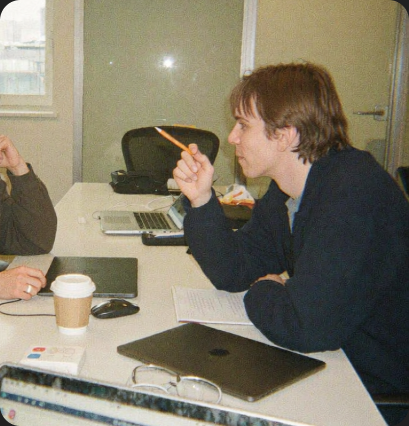 Artyom collaborating with a colleague at a desk